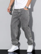 Distressed Tapered Denim Jeans