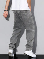 Distressed Tapered Denim Jeans